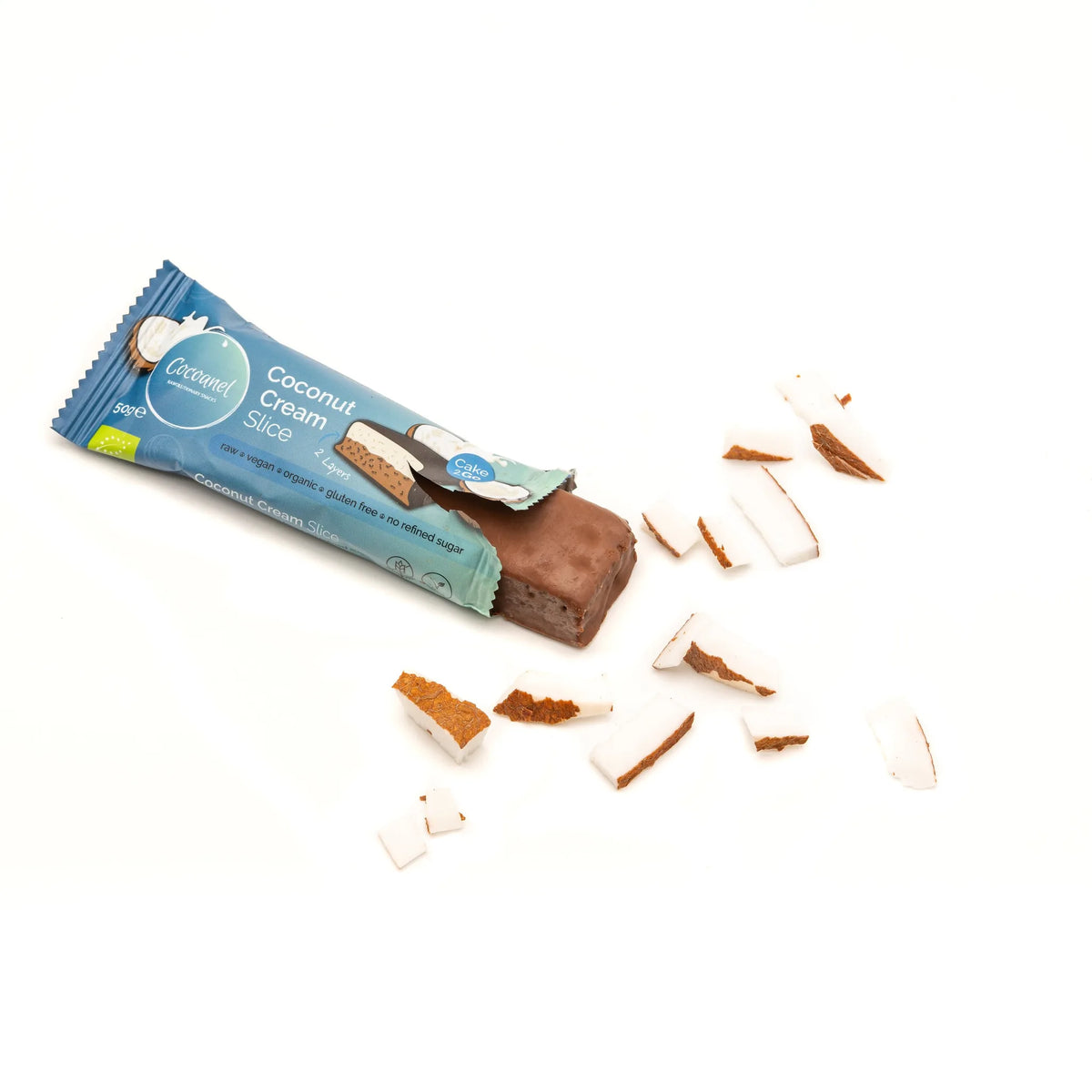 Coconut Cream Slice: angebrochener Riegel in Verpackung mit Kokosstücken