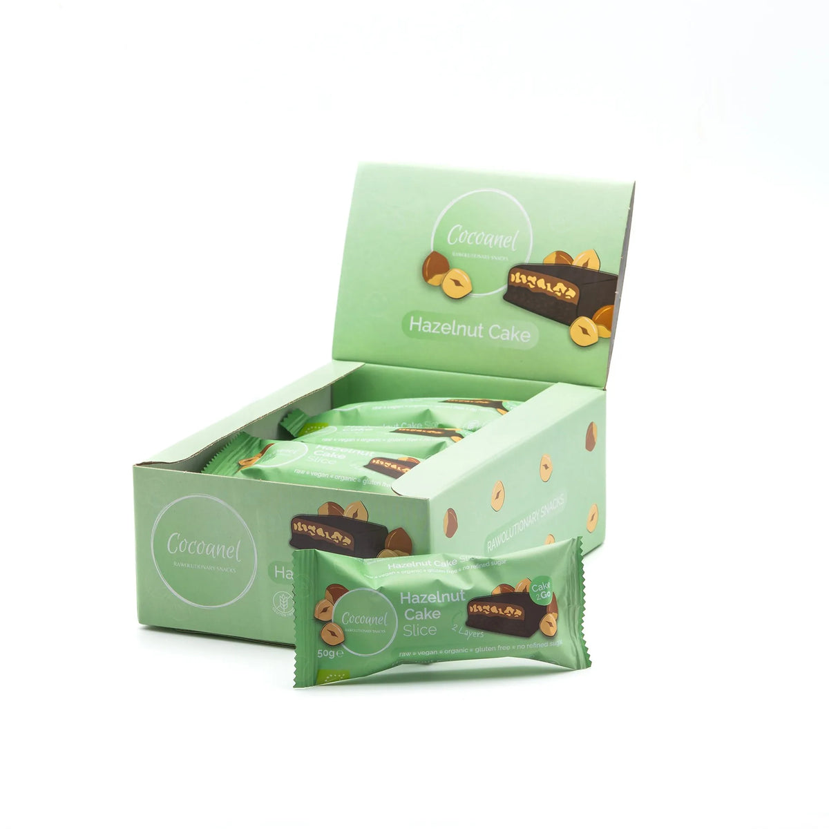 Hazelnut Cake Slice: geöffnete Box mit Riegeln, ein Riegel davor
